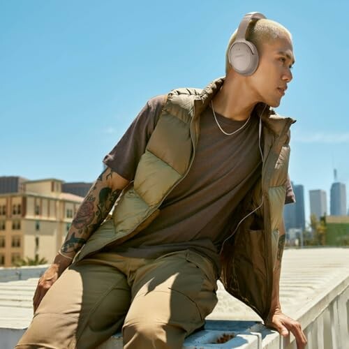 Man wearing headphones on a rooftop